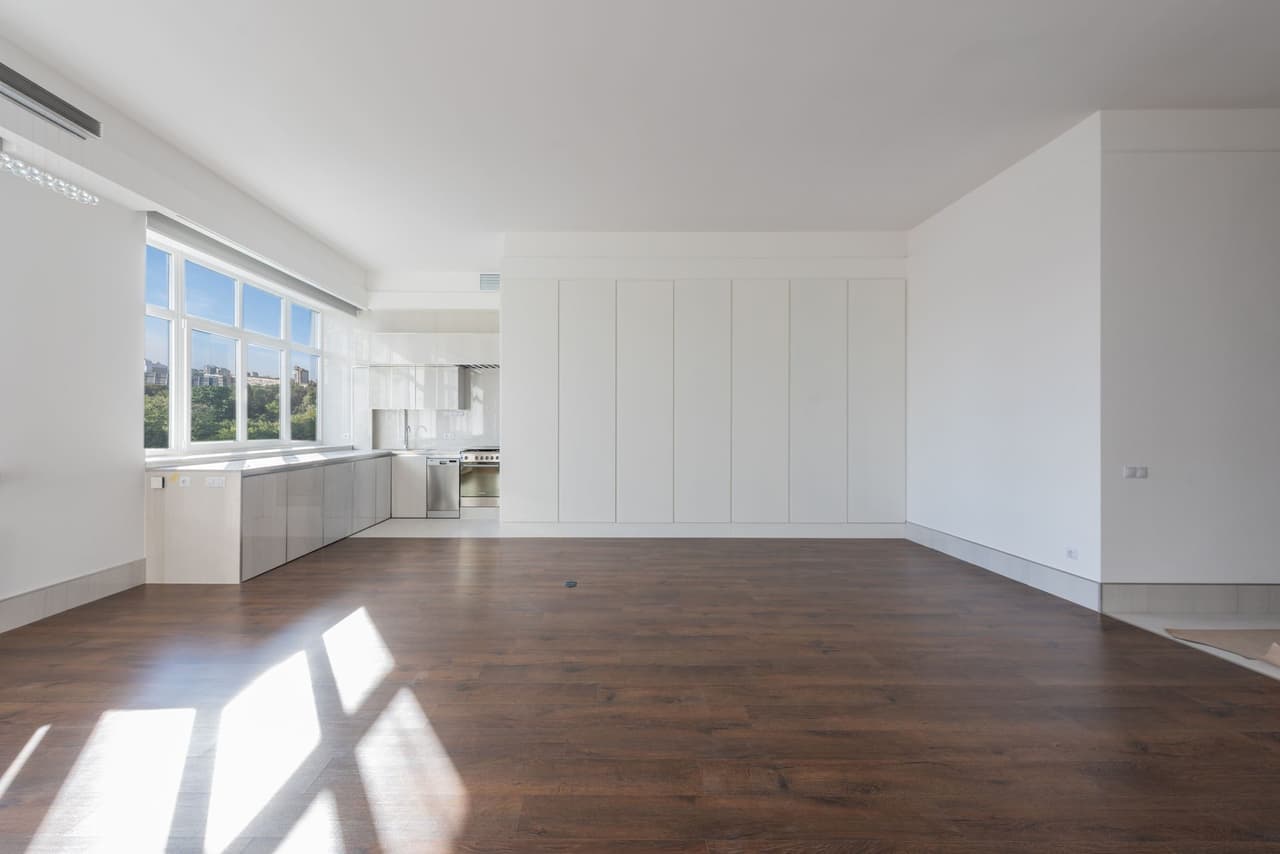 Modern kitchen with dark wood-plank flooring, the most common Shelby County main-level upgrade