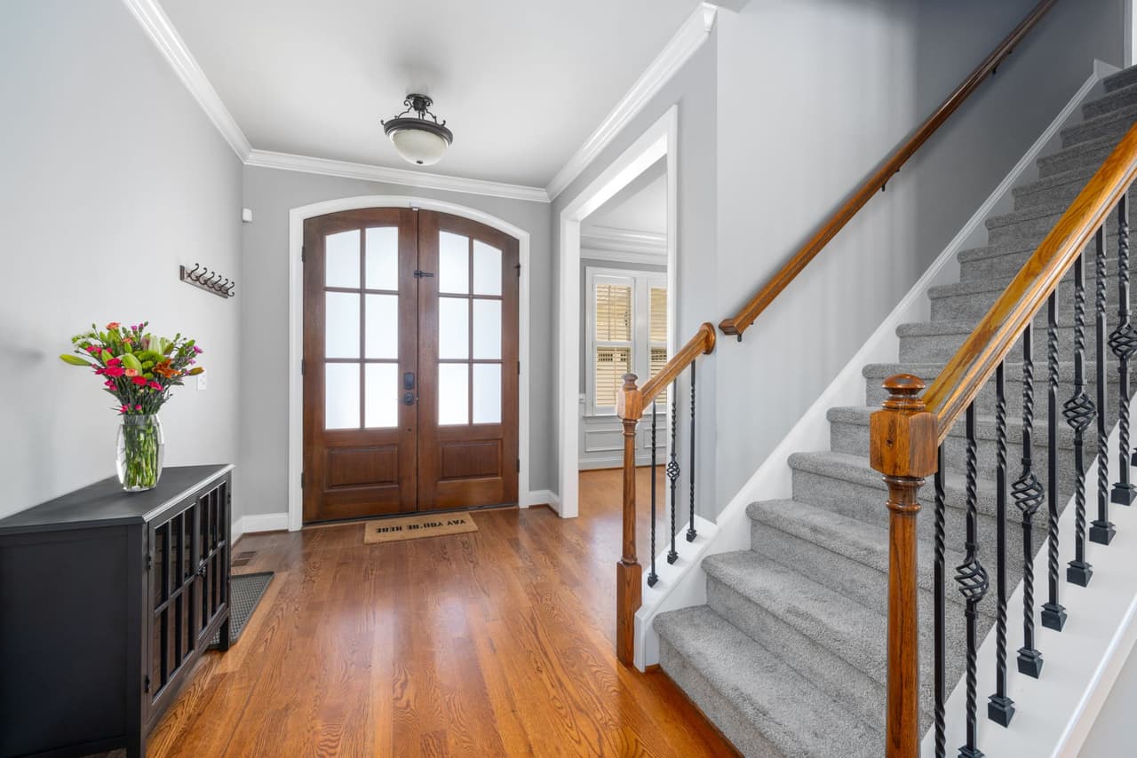 Carpeted staircase in a two-story home, the highest-visibility carpet in a Collierville project